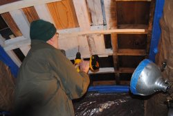 Buzz drilling a pilot hole through the Ely roof