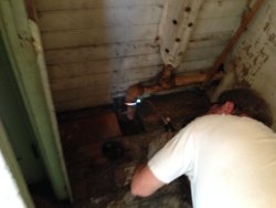 Chuck heating a pipe in the X-5000 to remove it - Photo by Warren Newhauser