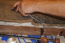 John working on layers of seat material for a Henrietta coach seat - Photo by Shelly Vanderschaegen