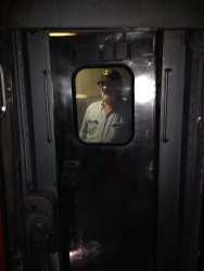 Michael Baksic looks through the Birmingham kitchen door as it is being installed - Photo by Michael McCraren