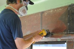 Closer shot of Mark grinding the surface smooth - Photo by Shelly Vanderschaegen