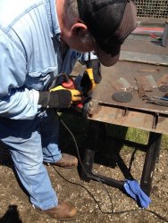 Mike Baksic cleans up to area to be patched - Photo by Michael McCraren