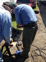 Ray Mormann and Mike Baksic work on the door bottom - Photo by Michael McCraren