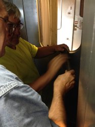 Ray Mormann and Mark Gellman prepare the door window opening - Photo by Michael McCraren