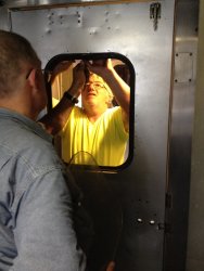 Ray and Mark set the rubber to hold the window - Photo by Michael McCraren