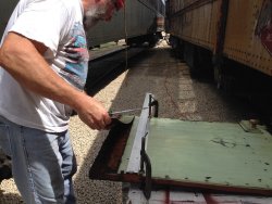 Chuck lifting off the old piece of panel - Photo by Warren Newhauser