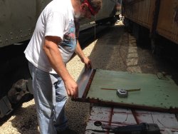 Chuck fitting the patch on the panel bottom - Photo by Warren Newhauser