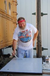 Chuck Trabert painting a refurbished Dynamometer door - Photo by Shelly Vanderschaegen