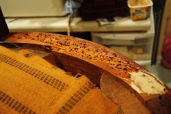 Many tack holes in the Lounge Car seat frame - Photo by Shelly Vanderschaegen