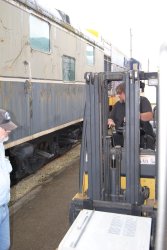 Jeff Calendine at the fork lift controls for AC removal - Photo by Shelly Vanderschaegen