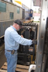 Michael Baksic stands on the fork lift platform - Photo by Shelly Vanderschaegen