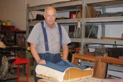 John McKelvey with material from a Santa Fe Lounge Car seat - Photo by Shelly Vanderschaegen