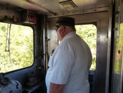 Michael McCraren in charge of the westbound Denver Zephyr (note the red glow from the functioning marker lights) - Photo by Kevin Brown using Brian LaKemper's camera 