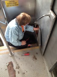 Mark Gellman working on making the sliding door function better - Photo by Michael McCraren