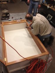 Buzz working on the cabinet hardware - Photo by Michael McCraren