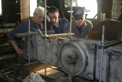 Cameron and Phil work with Tom on the bolster