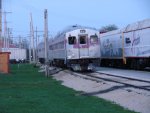 as the suns sets, the set, headed up by its new end car, slides into its siding