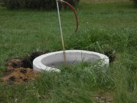 Blow pipe used to "bubble down" concrete pipe to correct depth.