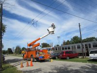 Notice the shorting and grounding cables installed on the old trolley bus wires for safety.