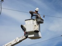 Installing hanger insulators for North bound trolley busses on Railroad Avenue.