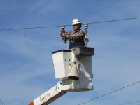 Installing conductor stringing blocks.  These will be used to pull-in and sag the new trolley wire.