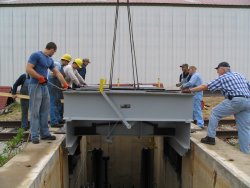 Guiding the table into place. (Stuart B. Brosh photo) 