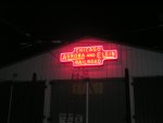 The restored neon CA&E sign on the front of barn 4 is lit for the first time