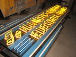 The restored IC electric sign in the B&G shop before mounting on barn 6.