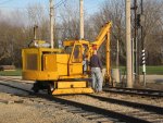 Frank shows our visitor, Paul, the controls of the tie crane