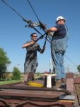 Charlie and Max getting the frog all hooked up