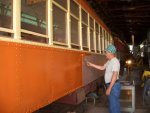 08.12.09 - PETE GALAYDA IS APPLYING ORANGE PAINT TO THE SIDE OF THE MILWAUKEE 972.