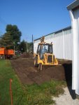 09.02.09 - DAVE DIAMOND IS STARTING TO EXCAVATE FOR THE NEW WOOD SHOP EXTENSION.  BY THE END OF THE DAY, THIS WAS COMPLETE AND HE WAS PUTTING CRUSHED STONE INTO PLACE.