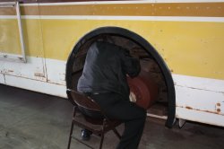 Wally Unglaub really getting into his work, removing curd from inside the street-side rear wheel well of the 633.  02/19/2011