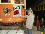 Refinished metal sign being mounted