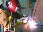New deck plates are welded in place by Jerry Dettloff