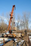 Tom hooking the foundations from the CNW flatcar