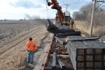 Swinging bundles of new ties along the mainline. 3-13-11