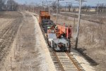 Work train with caboose and new ties heads out to drop off the bundles 3-13-11