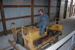 Phil running the compressor into the barn for spot tamping.