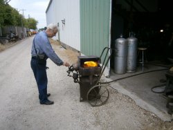 Working again Tom tests the rivet furnace