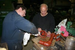 Stu and Bob work on planer parts