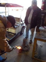 Gerry using "torch" to cut off old bolt,  12-5-12