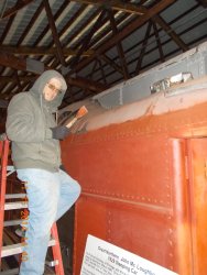 Bob Olsen scraping the tar and old paint off the roof of John Mcloughlin   11-15-14  DSCN1179