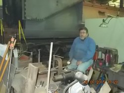   This is Dennis our welder resting a few minutes while working on repairs for the 1630 2-7-15 DSCN1251