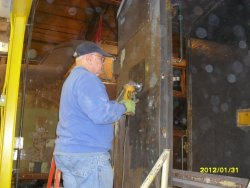 Joe using wirewheel to smooth steel in prep for future priming 1-31-2012