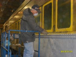 "Bondo" Bill working more of his magic ie caulking underneath window frames  1-31-12