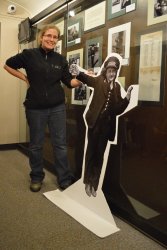 Gwyn poses with a North Shore woman standee in her exhibit