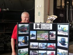 Nick Kallas is prepared to man the museum's booth with plenty of brochures and a poster with photos of the museum - Photo by Brian LaKemper