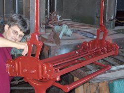  Here  Loraine Bixler is painting the first rebuilt seat frame  DSCN0589