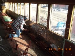   Gary is grinding old bolt heads off last panel on this side.  This is scheduled for replacement in the coming weeks. 3-26-14    fDSCN0771